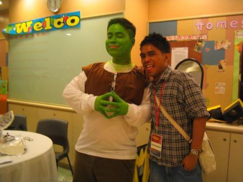 Ganns Deen, a Filipino children's party host in Canberra, dressed up as Shrek